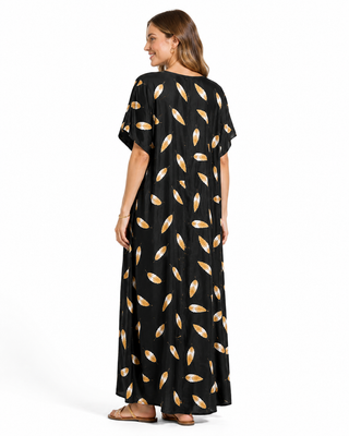 Black kaftan dress with gold leaf shapes