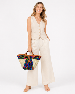 Woven straw Kiondoo basket featuring a red fabric band with a bold pattern and orange accents (Copy)