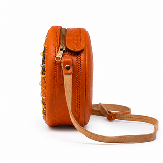 Round orange and black woven handbag with sequins